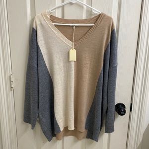 Size Medium Sweater from Magnolia Boutique.